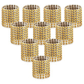 Anillos Accmor dorados con brillo para servilletas en mesas elegantes.