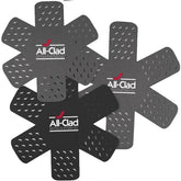 All-Clad protecciones de ollas con patrón estelar protegen superficies durante almacenamiento.