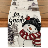 Mantel Artoid Mode con árboles navideños y nieve para ambientar la mesa.