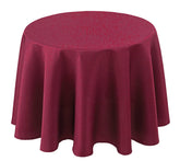 Mantel Biscaynebay redondo texturizado de 70 pulgadas añade elegancia a la mesa.