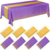 Breling mantel plástico desechable en tonos púrpura y oro para fiestas.