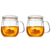Taza DOPUDO de vidrio 2-pack con infusor y tapa, ideal para infusiones en la oficina.