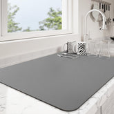 Ecotrim alfombrilla absorbente para secar platos, evita goteos y mantiene la superficie limpia.