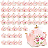 Cajas dulces Eorbow en tetera rosa con lazo para recuerdos elegantes.