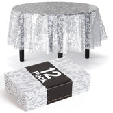 Mantel redondo Exquisite de encaje blanco protege la mesa con estilo.