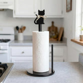 Ferrochef sostén de papel con gato negro giratorio sobre base estable.