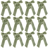 Gandeer anillos para servilleta con lazo de terciopelo verde, ideal para una mesa elegante.