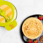 Grinch Waffle Maker: rostro detallado, ideal para desayunos temáticos y divertidos.