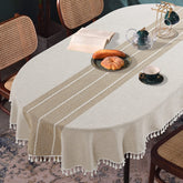 Mantel ovalado HOMBYS con bordado de cuadros y borlas para cenas elegantes