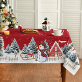 Mantel Horaldaily navidad con nieve y casita para cenas festivas.