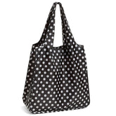 Kate Spade New York tote reutilizable con lunares negros, elegante para compras.