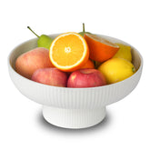 Magclay frutero de cerámica con drenaje, exhibe frutas frescas en mesa.
