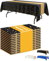 Niuara mantel negro con puntos dorados realza la mesa en eventos elegantes.