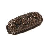 Nordic Ware 93448: Molde bronce con diseño trigo y calabaza, ideal para panes decorados.