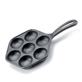 Norpro sarten hierro fundido en uso diario para desayunos de aebleskiver.