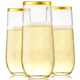Vaso champán plástico de Oojami 9oz con borde dorado, ideal para brindis elegantes.