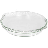Plato Pyrex para tarta de vidrio claro con borde acanalado, ideal para hornear y servir.