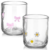Skylety dos copas con lazo rosa, ideales para brindis elegantes.