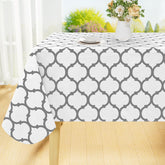 Mantel rectangular impermeable Smiry protege la mesa durante comidas.