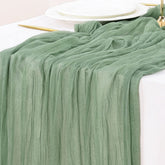 Socomi mantel de gasa verde salvia, vista plana, ideal para decorar mesas.