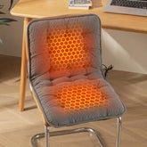 Almohadilla caliente Suchtale para asiento de pana suave, ideal para sesiones largas y confort térmico.