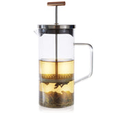 Teabloom prensa para té con manija de cobre, ideal para infusiones elegantes.