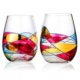 The Wine Savant vaso de vino sin tallo pintado a mano para una mesa elegante.