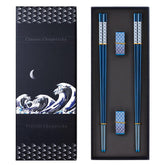 Palillos TIICOO titanio plateados, con acabado azul, para mesa elegante.