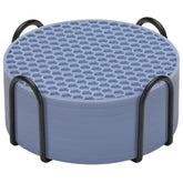 TWTLi posavasos azules con soporte protegiendo la superficie.