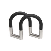 Umbra Swivel porta-servilletas ajustable en negro níquel para mesas limpias.