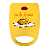 Uncanny Brands Gudetama sándwichera con dibujo en la tapa para cocina divertida.
