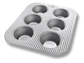 USA Pan bandeja muffin 6 tazas para horno tostador, facilita horneados rápidos y uniformes.