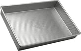 USA Pan: bandeja rectangular 9x13 para hornear pasteles de forma uniforme.