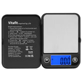 Vitafit balanza de bolsillo 500 g en frente del dispositivo para lectura rápida.