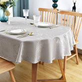 Mantel ovalado Wolkemer con jacquard brillante gris, ideal para cenas elegantes.