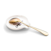 Reposacucharas Yenlni de cerámica con patrón y elipse dorada, ideal para ordenar cucharas de café.