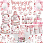 Banner Yingoto para 80.º cumpleaños decorando la mesa, estilo rosa y dorado.