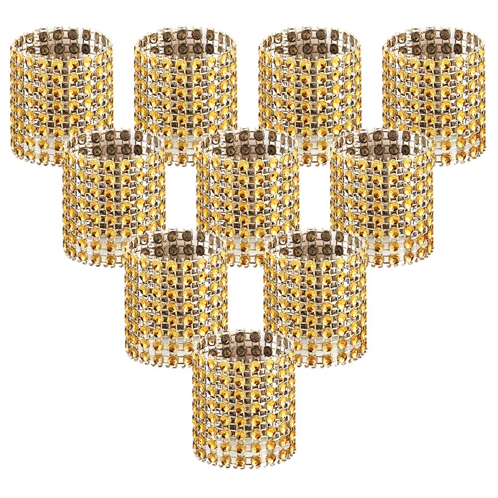 Anillos Accmor dorados con brillo para servilletas en mesas elegantes.