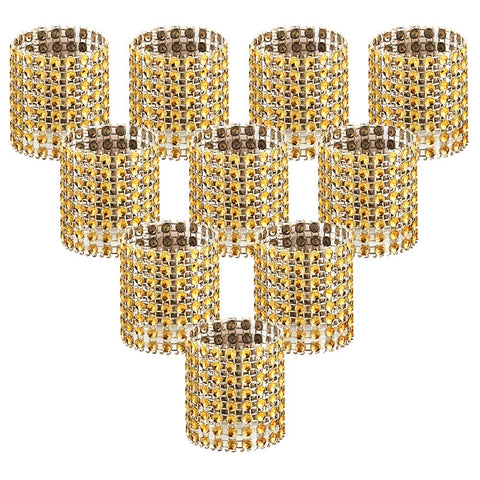 Anillos Accmor dorados con brillo para servilletas en mesas elegantes.