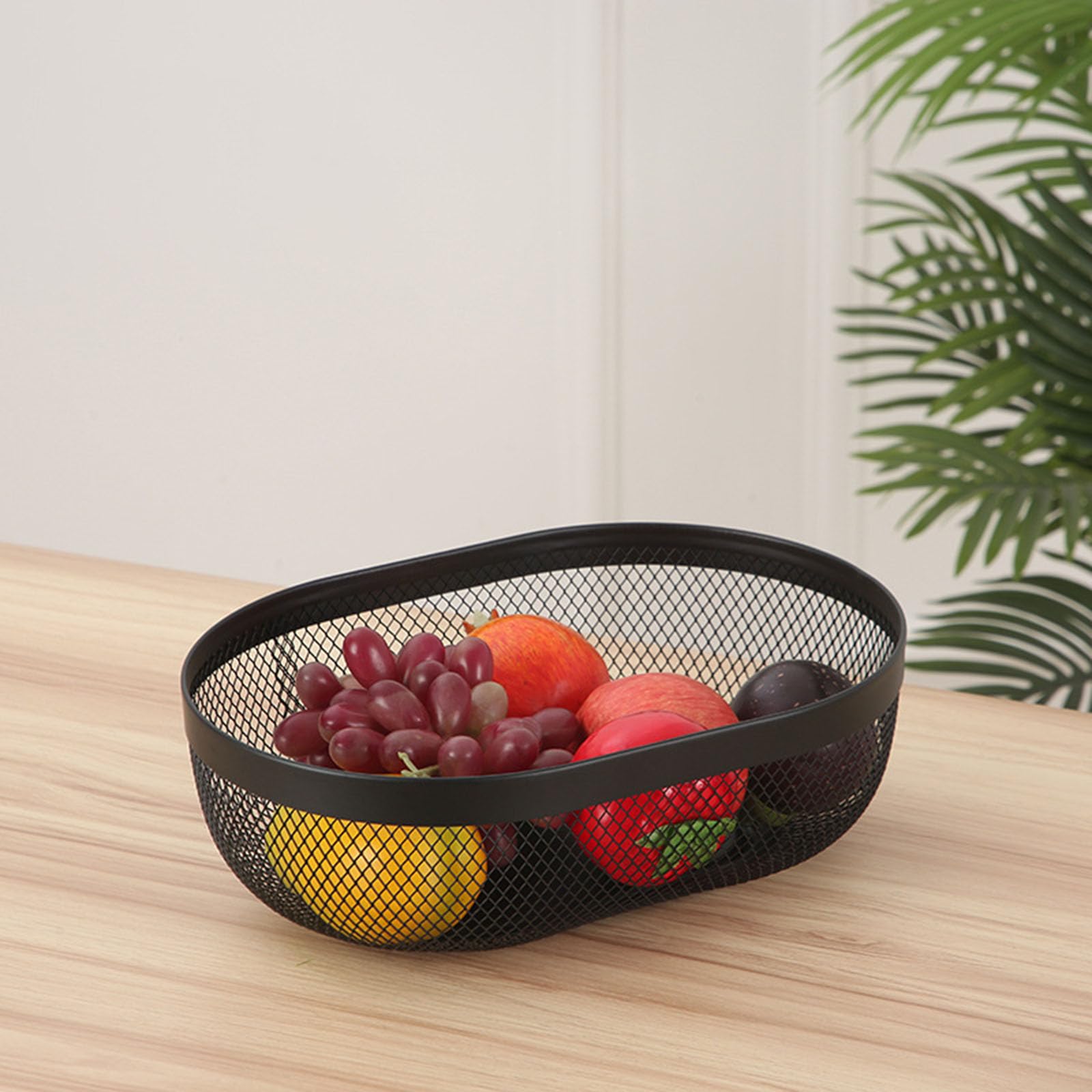 Cesta AJIODA de malla ovalada negra para uso diario en la cocina.