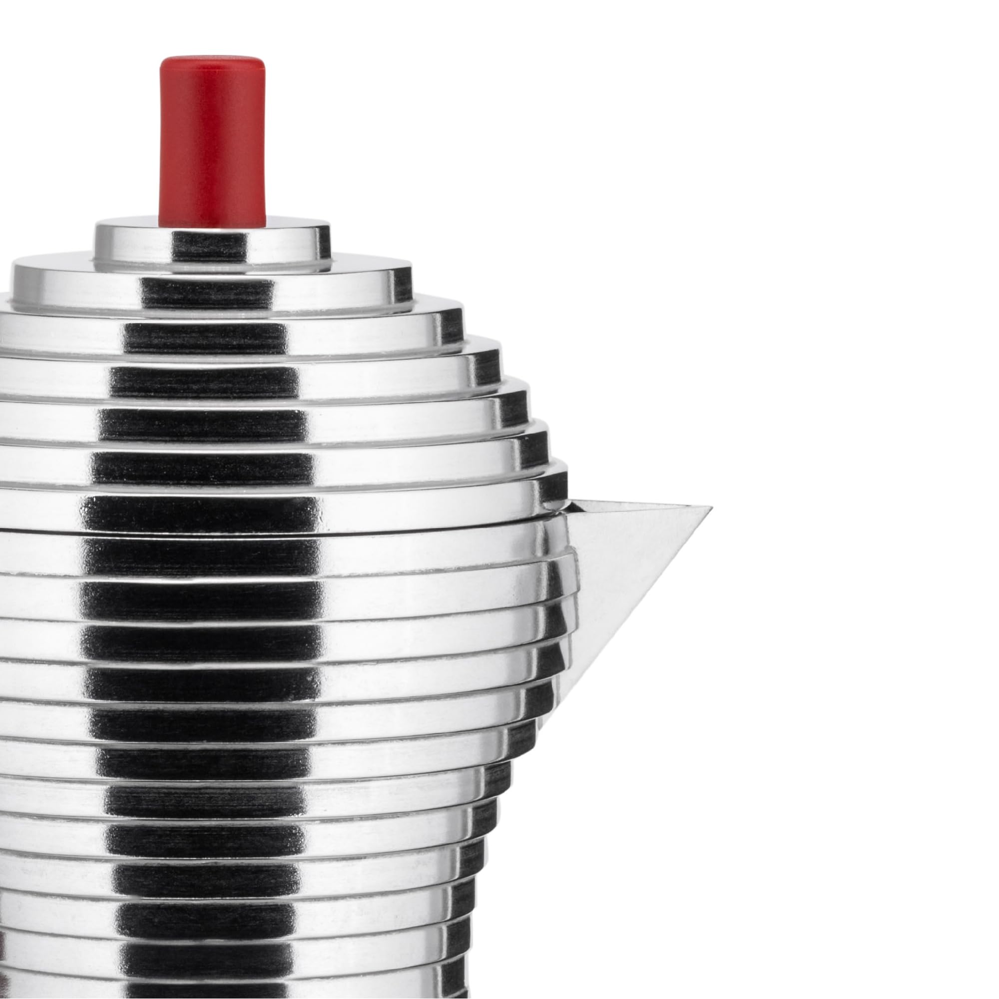 Alessi Pulcina: cuerpo de aluminio fundido para durabilidad y calentamiento uniforme.