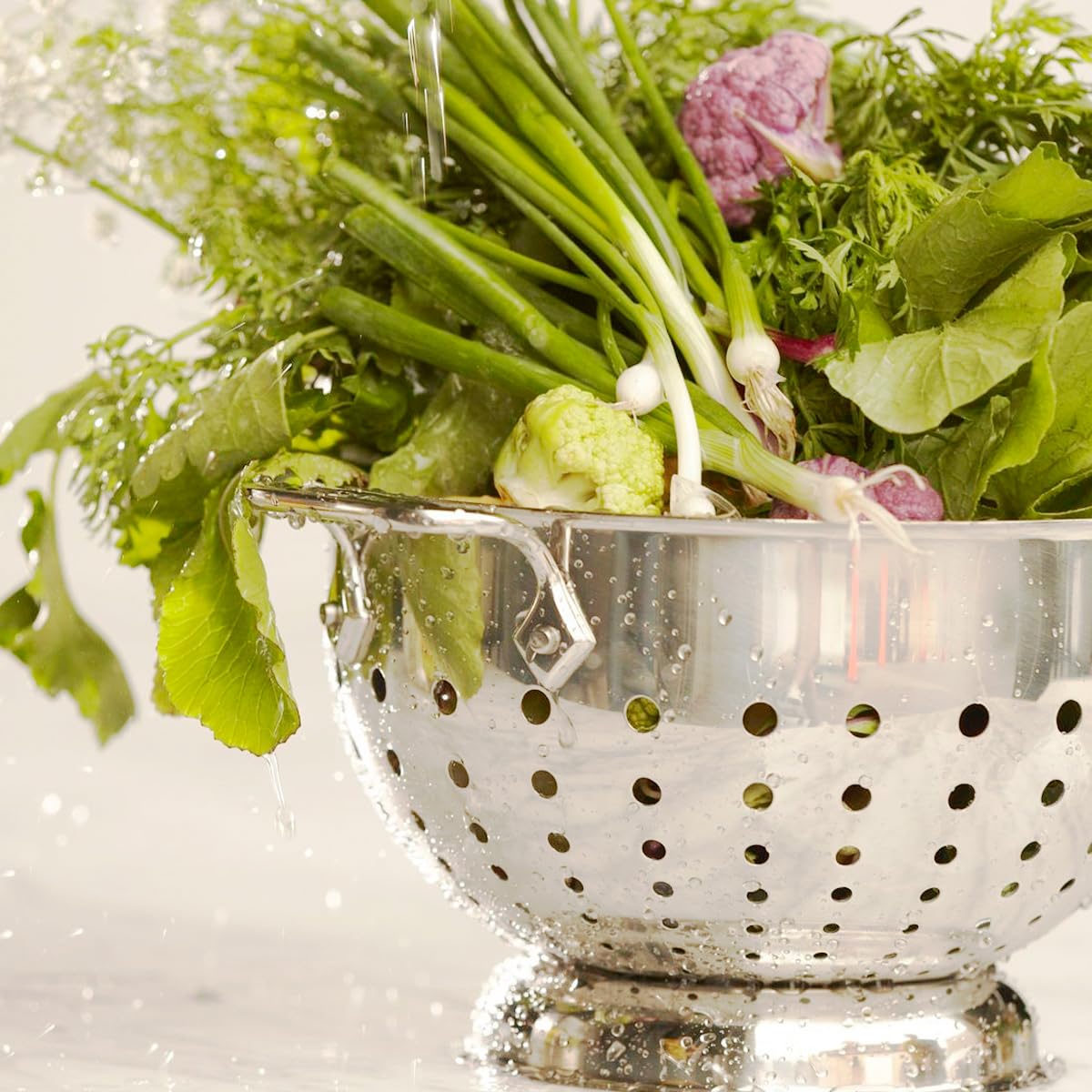 Colador All-Clad con mango integrado ideal para baño María.