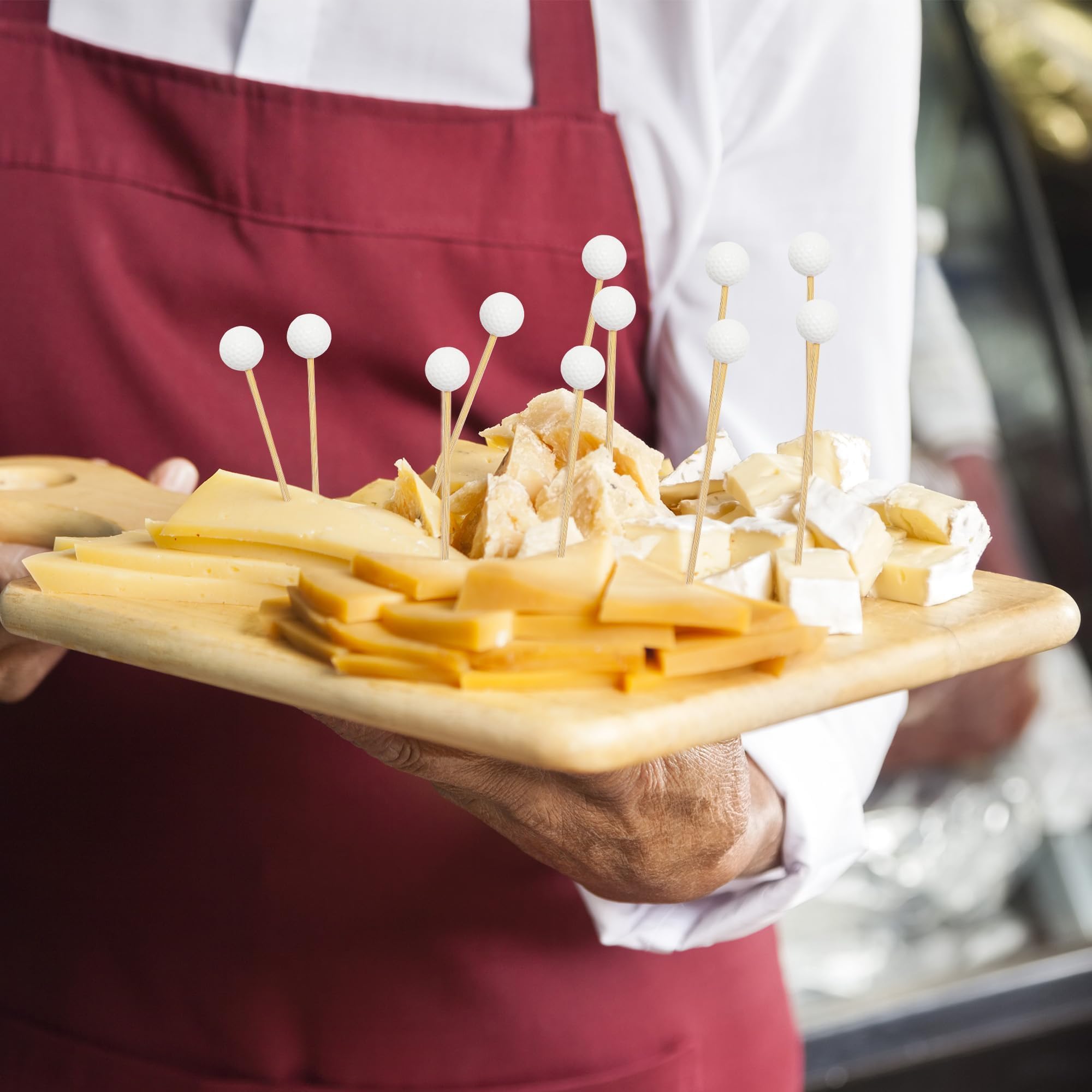 Palillos golf para fruta y queso, presentación atractiva.