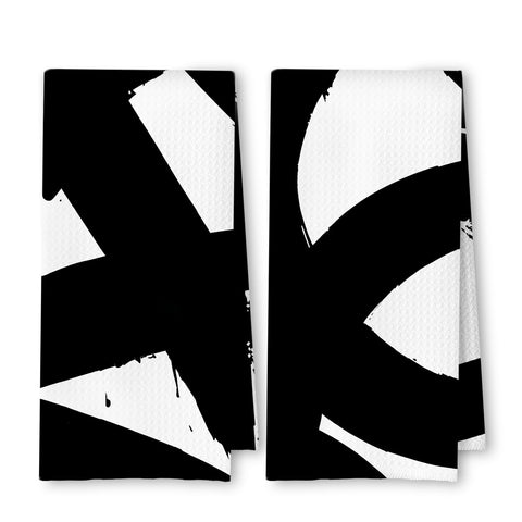 Toallas ArtisaEura, diseño abstracto negro-blanco, textura waffle para secado rápido.