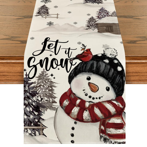Mantel Artoid Mode con árboles navideños y nieve para ambientar la mesa.