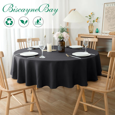 Biscaynebay detalle-textura mantel negro, realza la experiencia de comedor con tacto lujoso.