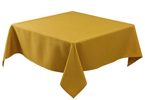 Mantel Biscaynebay con textura dorada para un comedor elegante y formal.