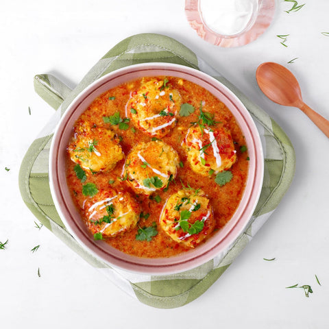 Almohadillas salvamanteles BONTHEE en verde a cuadros para superficies protegidas.