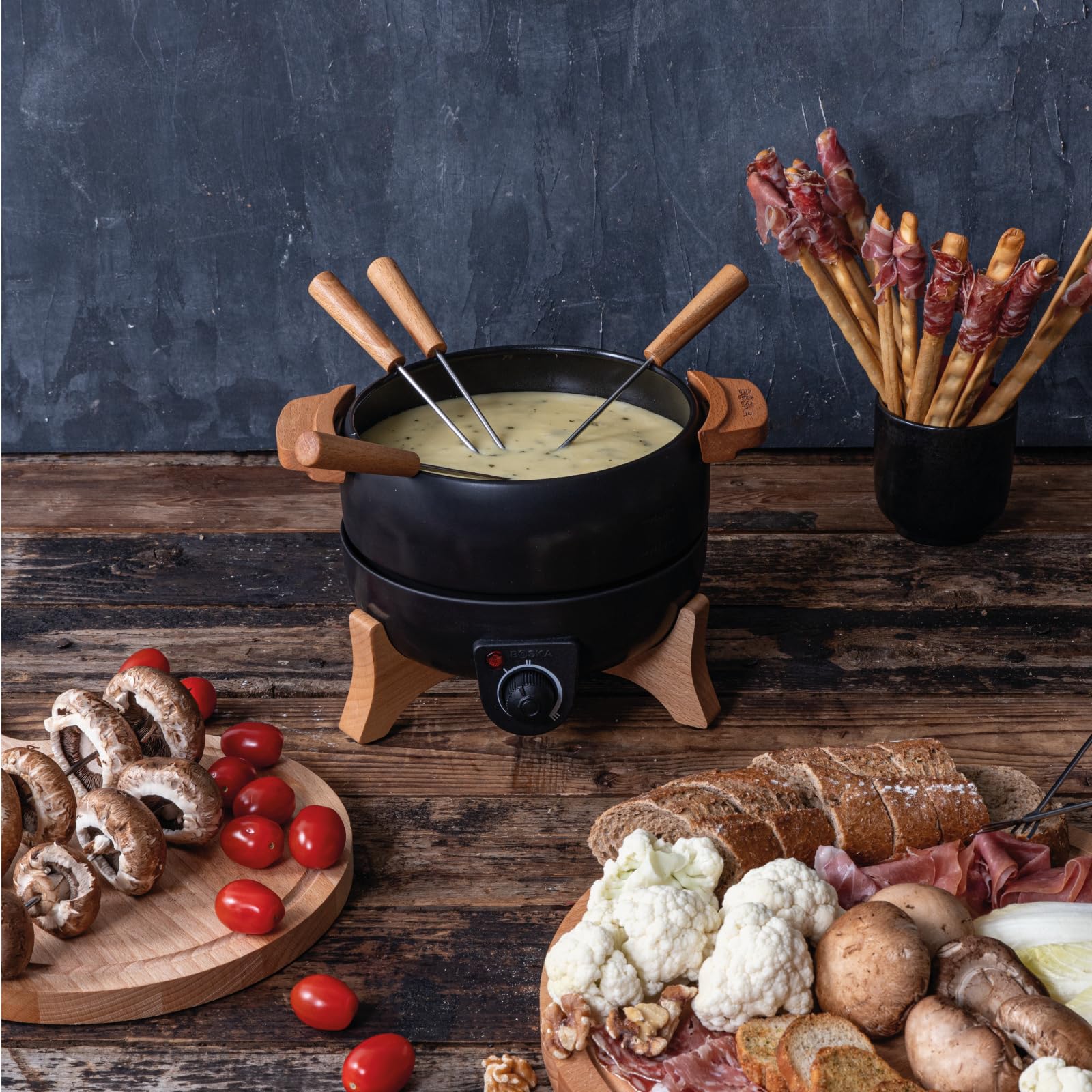 Boska fondue eléctrico Party con 8 tenedores para servicio elegante.