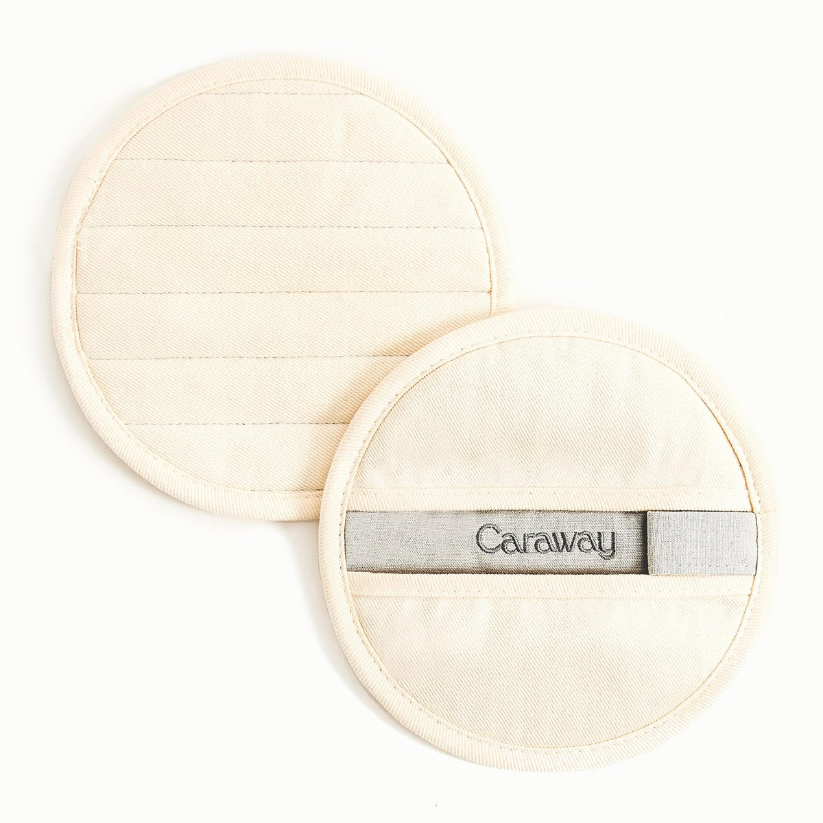 Manoplas Caraway en algodón 100% crema para manejo cómodo de ollas calientes.